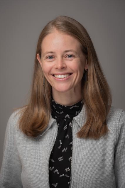 Eva Nichols in front of grey background