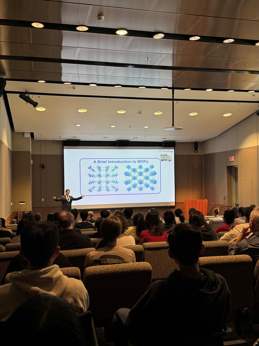 Seth Cohen standing in front of powerpoint titled A Brief Introduction to MOFs