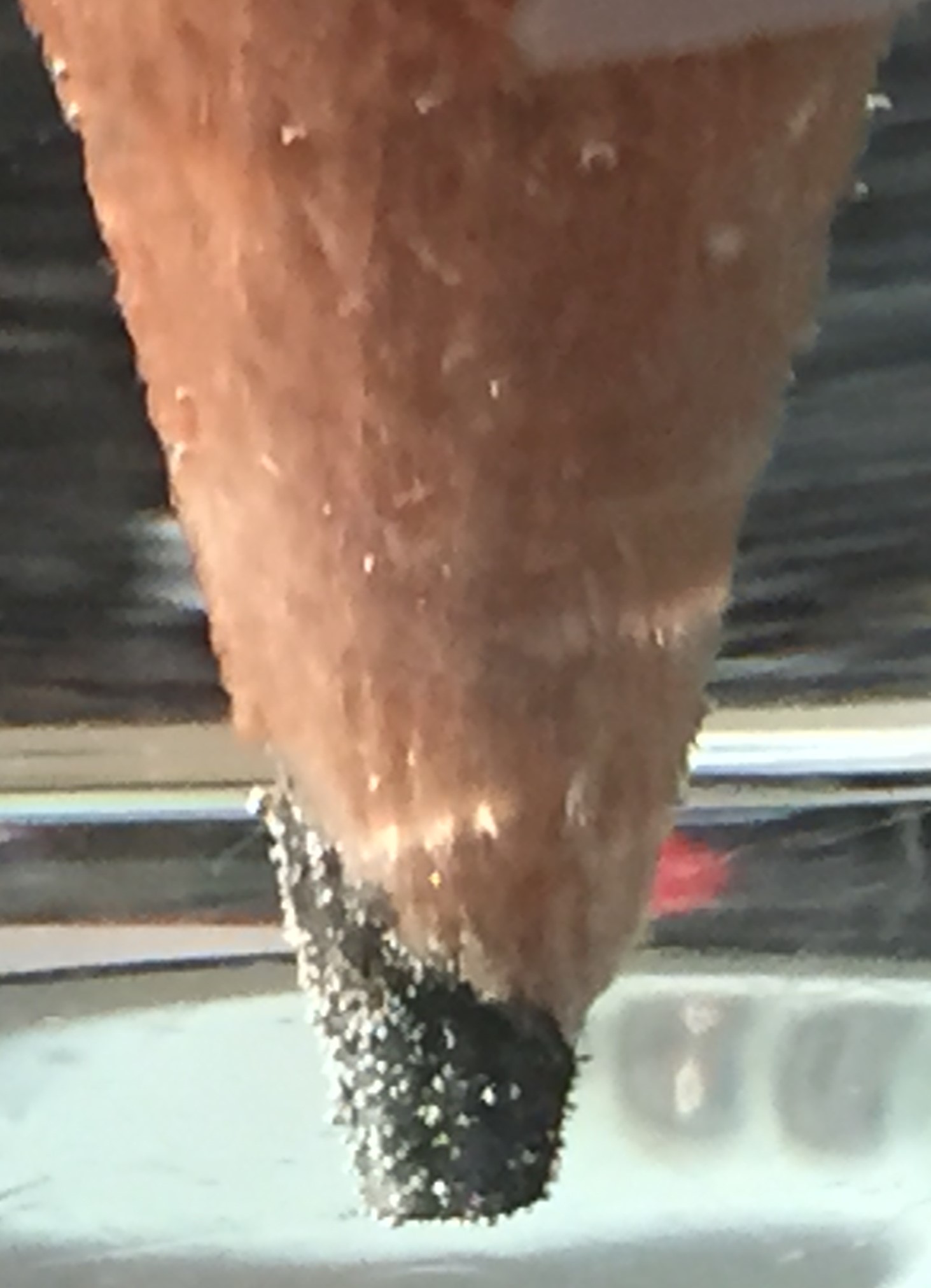 Photogenerated hydrogen bubbles on the tip of a graphite pencil electrode